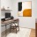 a room with a desk and a computer