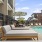 a pool with a deck and chairs by it